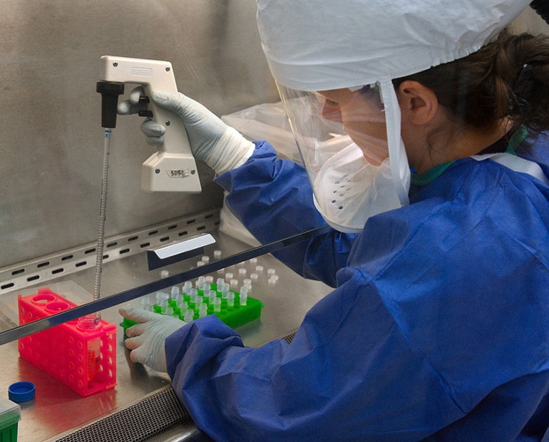 Researcher works with samples in lab 