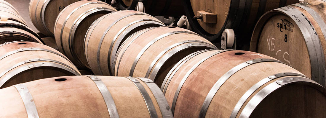 Rows of wooden whisky barrels 