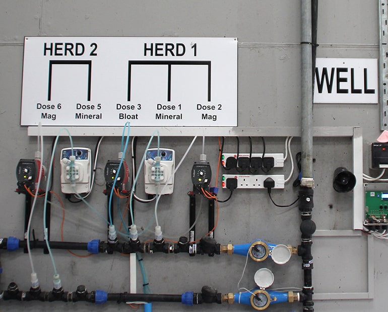 Prototype nutrient injection system mounted on wall 