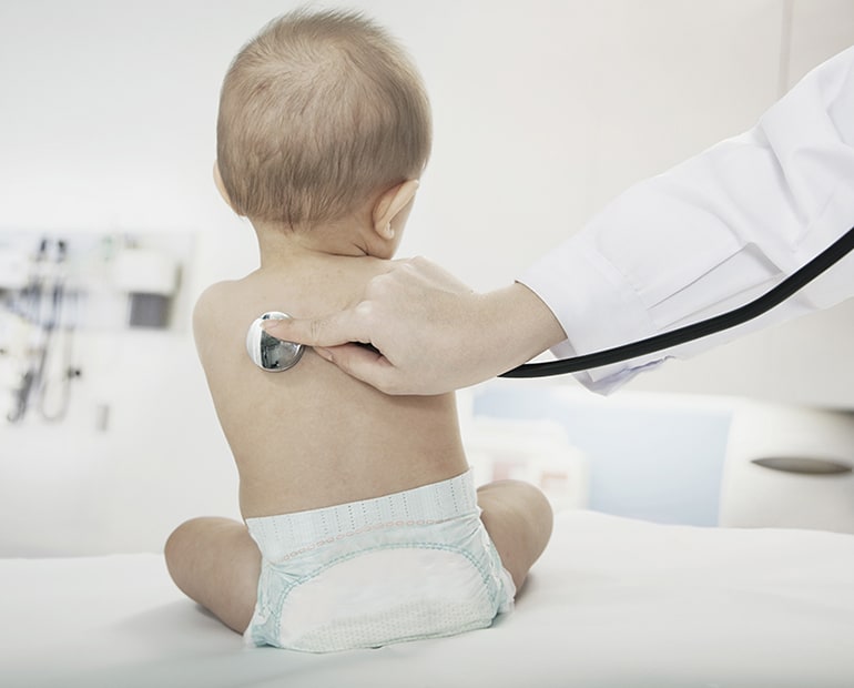 doctor examines babies breathing 
