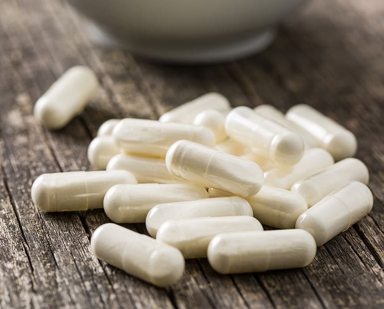 Collection of white medicine capsules 