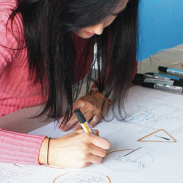 Female working with technical drawings