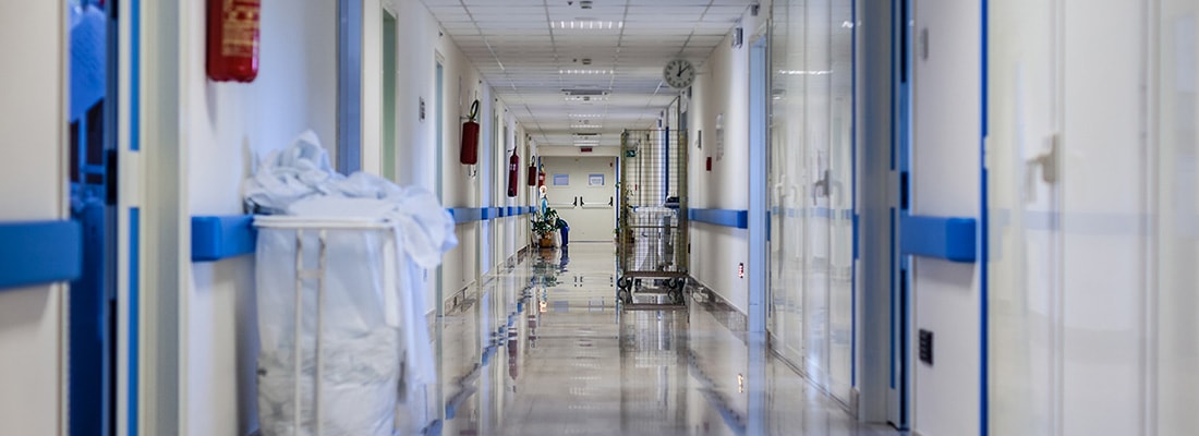 Hospital hallway with linen trolly 