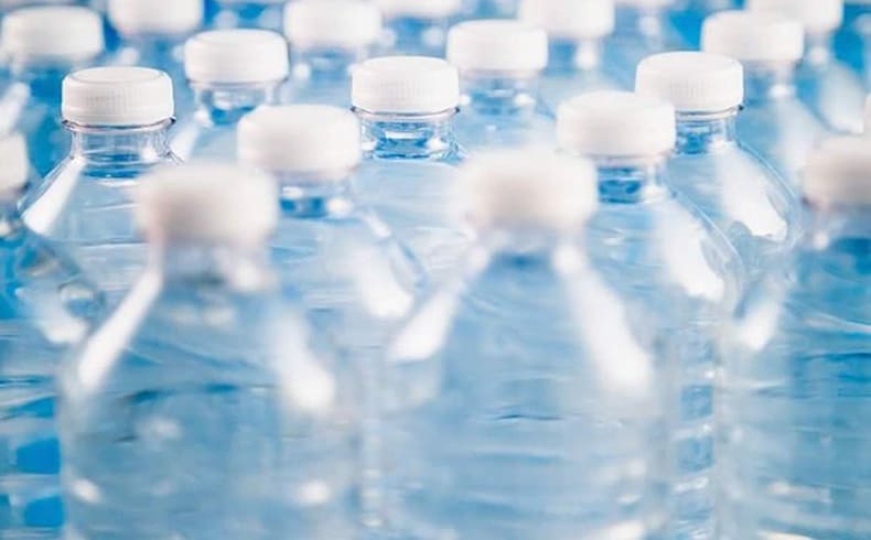 close up of Plastic bottles with white tops