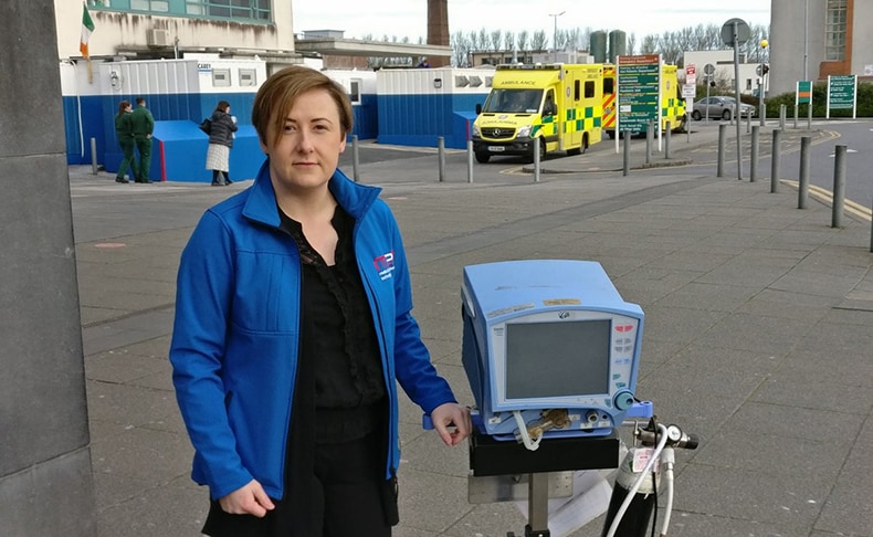 Sharon White, MET Technology Gateway Manager with ventilator outside UHG
