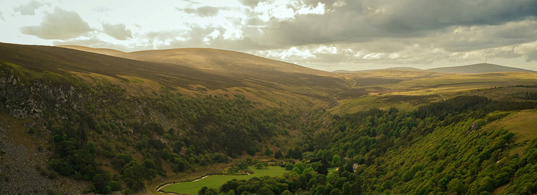 Green mountains and valley on a cloudy day 