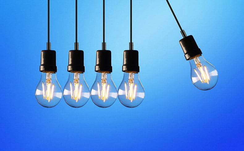 5 lightbulbs in a row with a blue background