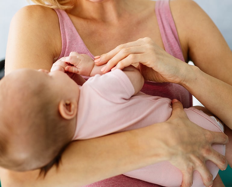 Female holding baby in her arms 