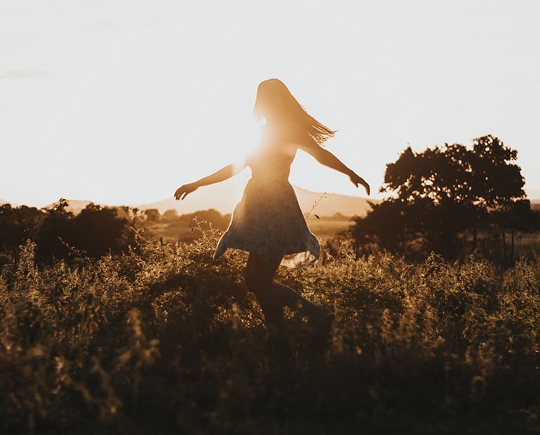 Female dancing in grass 