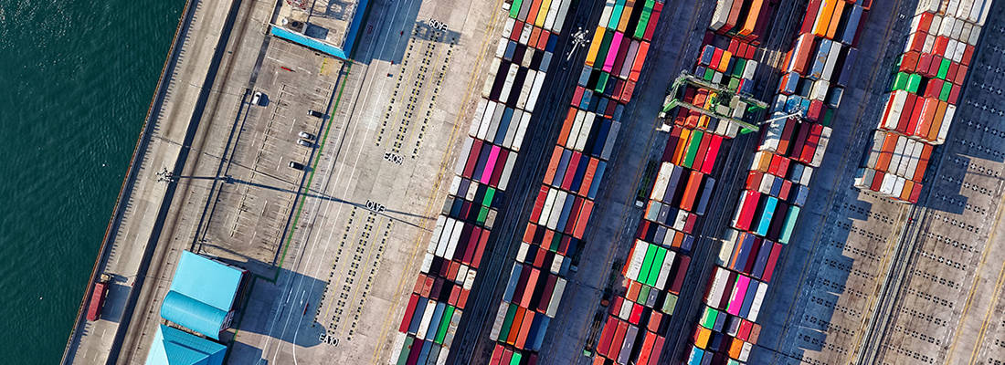Overhead view of a dock with colourful shipping containers