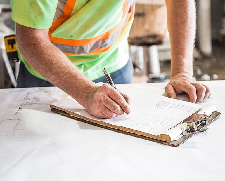 Construction worker with clipboard