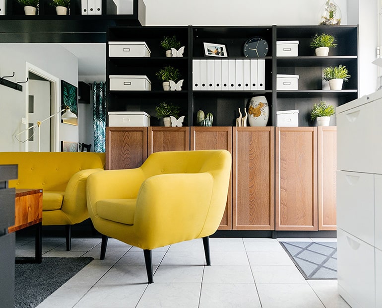 Yellow chair and sofa in office