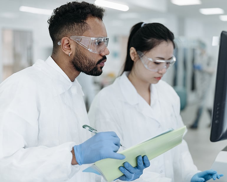 Male and female researchers in lab 