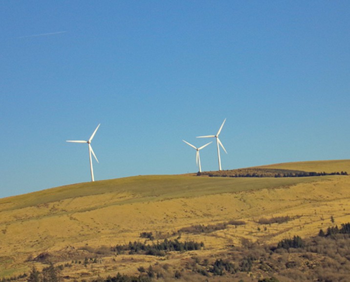 Three wind turbines on a hill