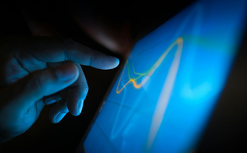 Hand Touching a Screen