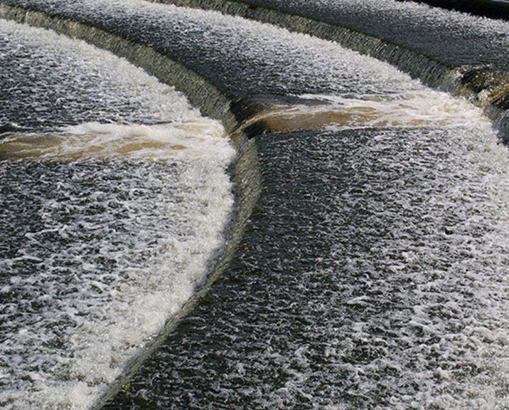 cascading water over concrete steps